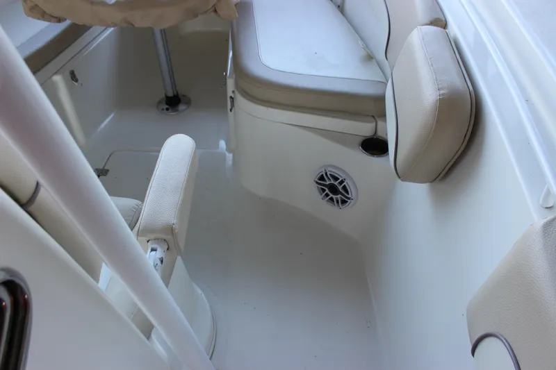 Slide: The Image of 2018 NauticStar 28 XS Offshore boat interior with seating and speaker. - 13