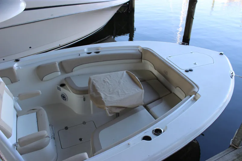 Slide: The Image of 2018 NauticStar 28 XS Offshore boat interior with seating and covered console. - 8