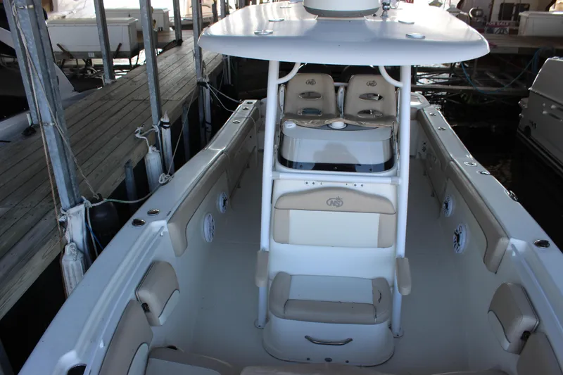Slide: The Image of 2018 NauticStar 28 XS Offshore boat interior with seating and console. - 9