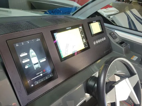 Slide: The Image of Aviara AV32 OB 2022 dashboard with advanced navigation displays and steering wheel. - 20