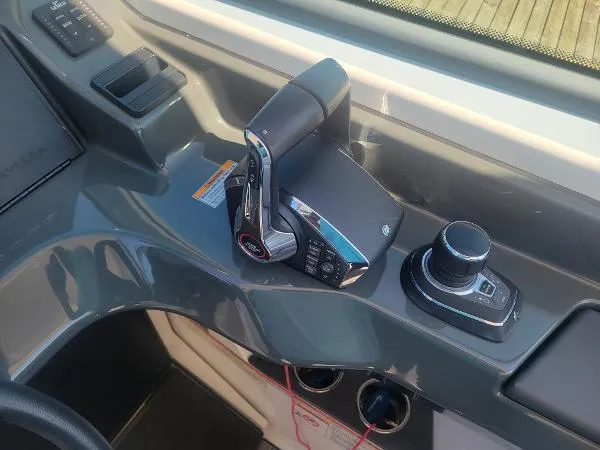 Slide: The Image of 2022 Aviara AV32 OB boat control panel with throttle and joystick. - 21