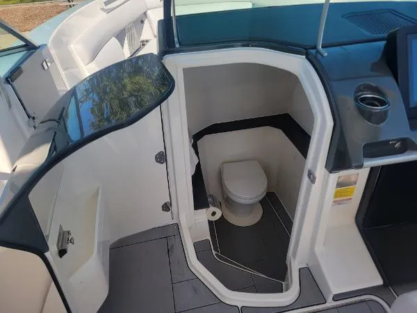 Slide: The Image of 2022 Aviara AV32 OB boat interior with compact bathroom and modern design. - 24