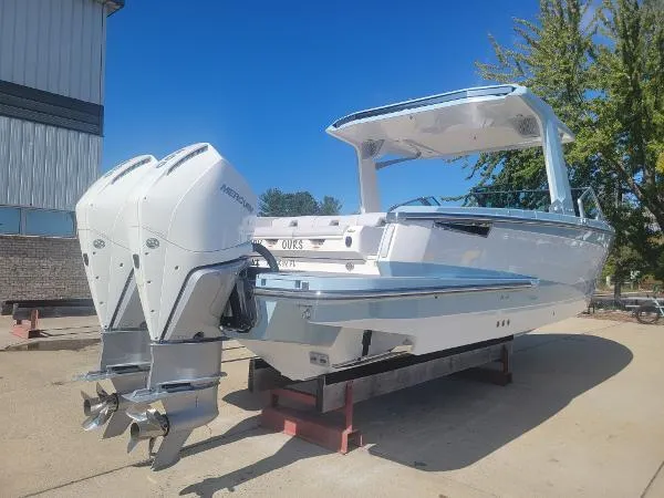 Slide: The Image of 2022 Aviara AV32 OB boat with dual outboard engines on display. - 4