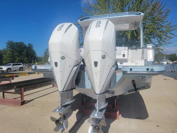 Slide: The Image of 2022 Aviara AV32 OB boat with dual outboard engines on a sunny day. - 5