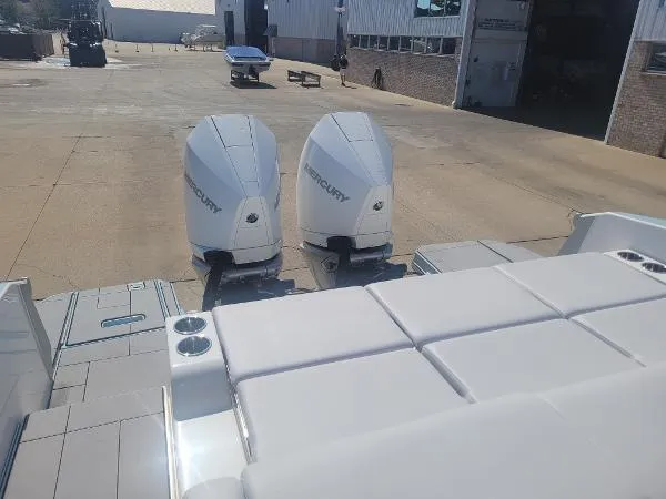 Slide: The Image of 2022 Aviara AV32 OB boat with twin Mercury outboard engines in a marina setting. - 7