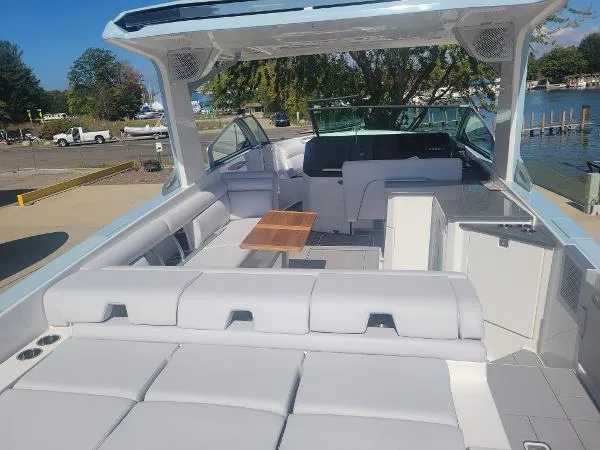 Slide: The Image of 2022 Aviara AV32 OB luxury boat with spacious seating and sleek design. - 9