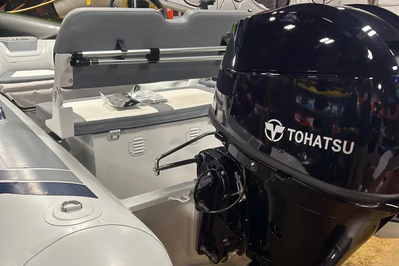 Slide: The Image of Highfield Classic 360 FCT 2025 boat with Tohatsu outboard motor. - 7