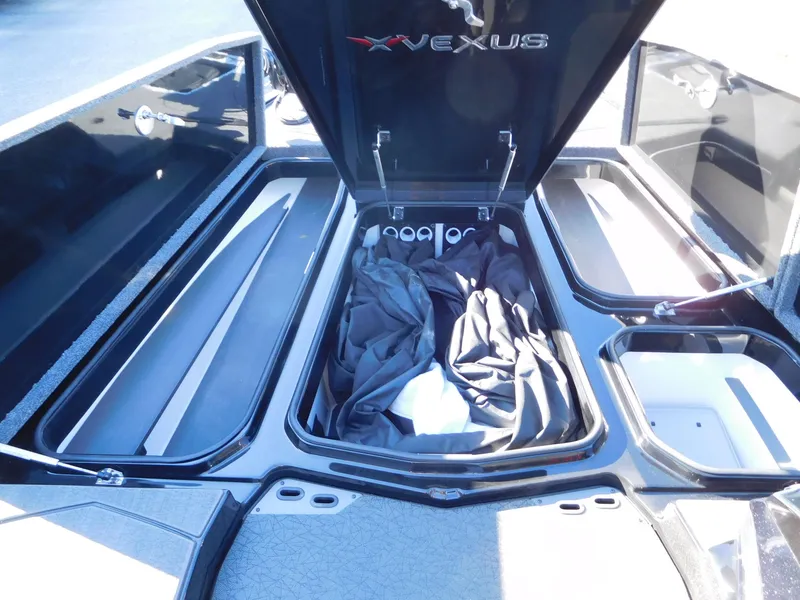 Slide: The Image of 2024 Vexus VXS 20 boat storage compartments with open lids, showcasing spacious interior. - 6