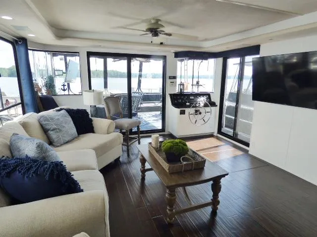 Slide: The Image of Luxurious 1997 Sumerset 16x80 houseboat interior with modern decor and lake view. - 3