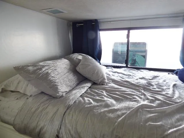 Slide: The Image of Cozy bedroom in 1997 Sumerset 16x80 houseboat with window view. - 6