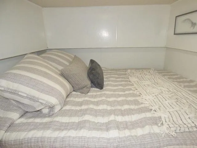 Slide: The Image of Cozy bedroom with striped bedding in 1997 Sumerset 16x80 houseboat. - 7