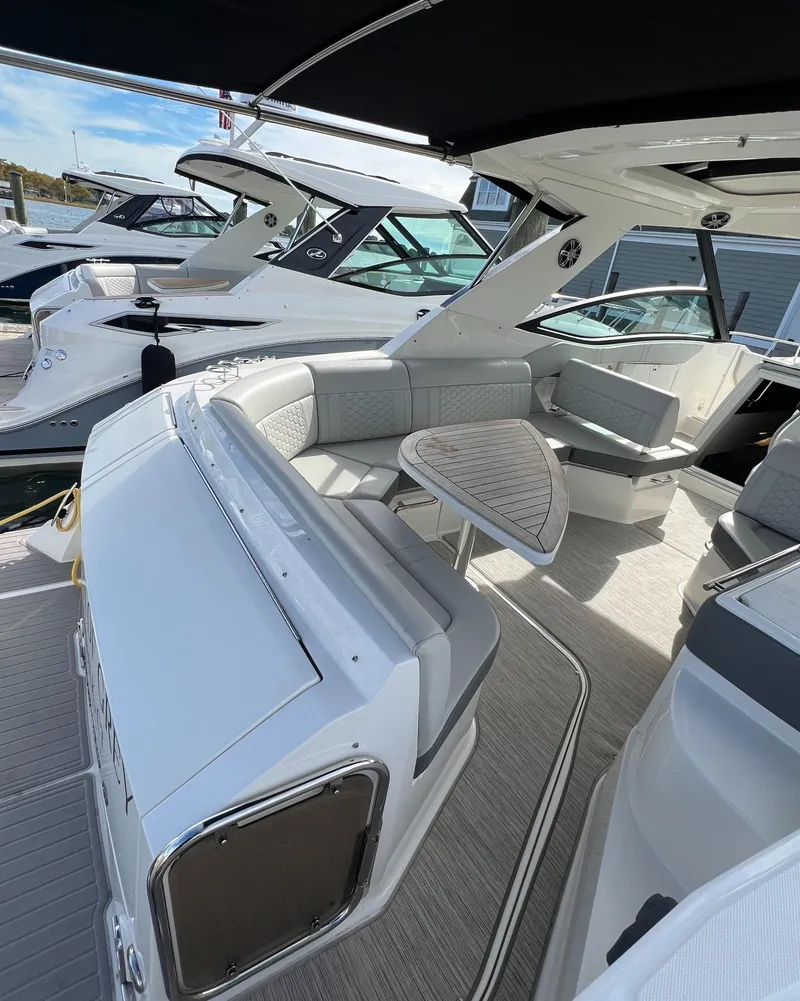 Slide: The Image of 2022 Sea Ray Sundancer 320 OB interior with sleek seating and modern design. - 14