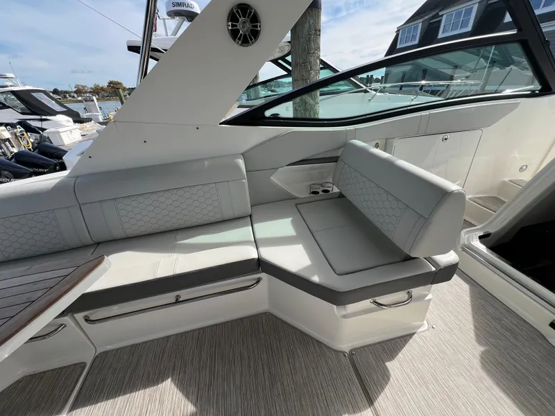 Slide: The Image of 2022 Sea Ray Sundancer 320 OB interior seating area with modern design and comfortable upholstery. - 17
