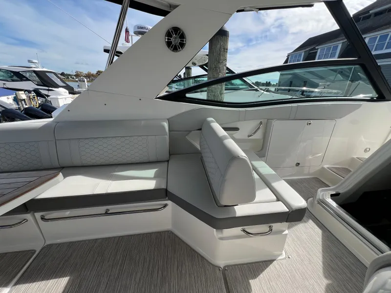 Slide: The Image of 2022 Sea Ray Sundancer 320 OB interior with sleek seating and modern design. - 18