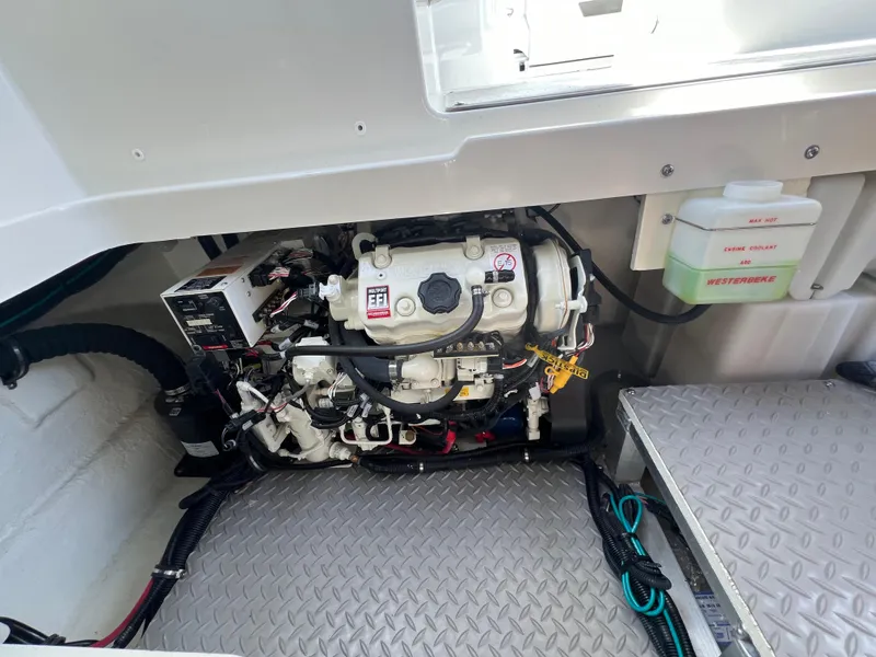 Slide: The Image of Engine compartment of 2022 Sea Ray Sundancer 320 OB with visible components and wiring. - 26