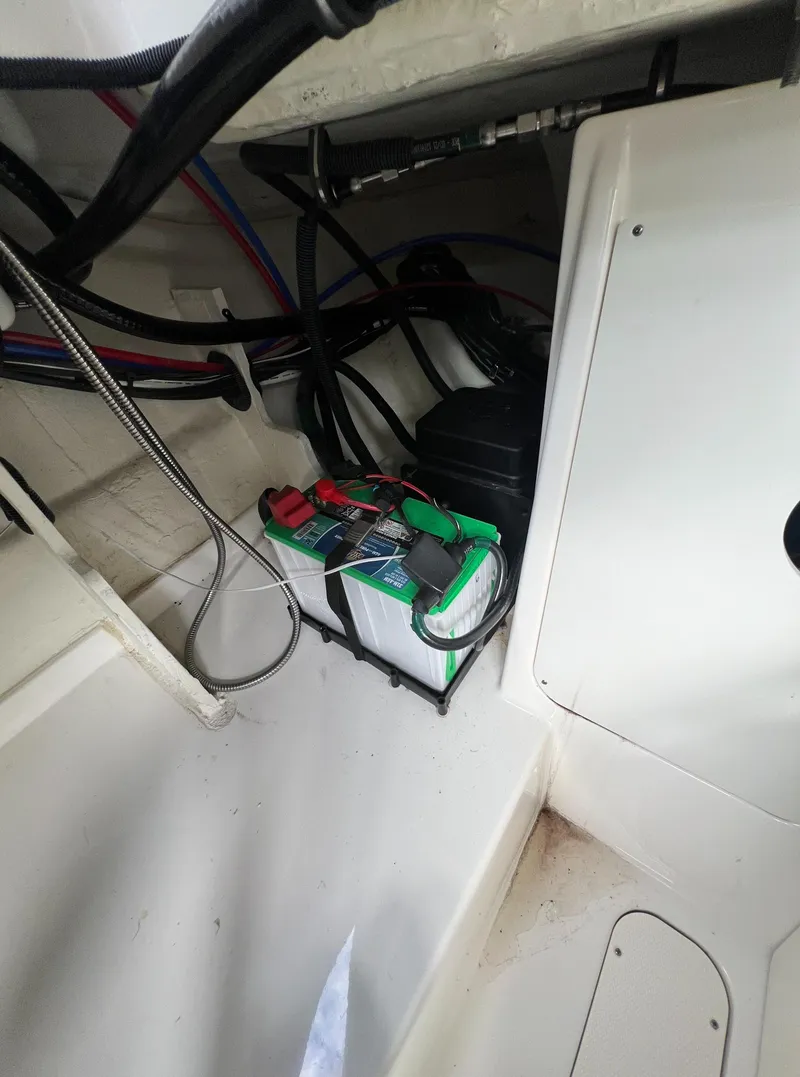 Slide: The Image of Battery compartment of 2022 Sea Ray Sundancer 320 OB boat. - 29