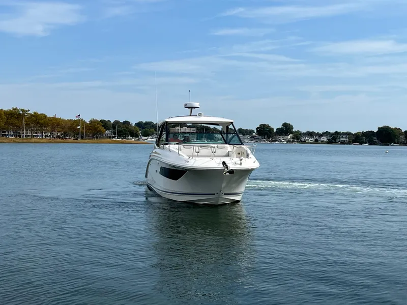 Slide: The Image of 2022 Sea Ray Sundancer 320 OB cruising on a calm lake. - 3