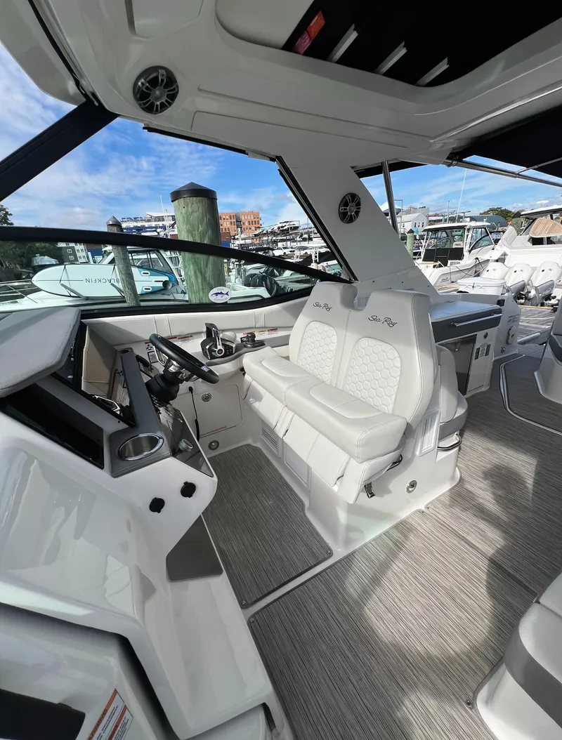Slide: The Image of Interior of 2022 Sea Ray Sundancer 320 OB, featuring modern helm and seating. - 31