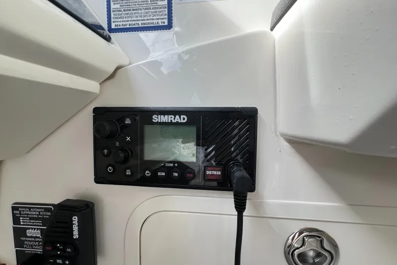 Slide: The Image of Simrad marine radio on 2022 Sea Ray Sundancer 320 OB dashboard. - 35