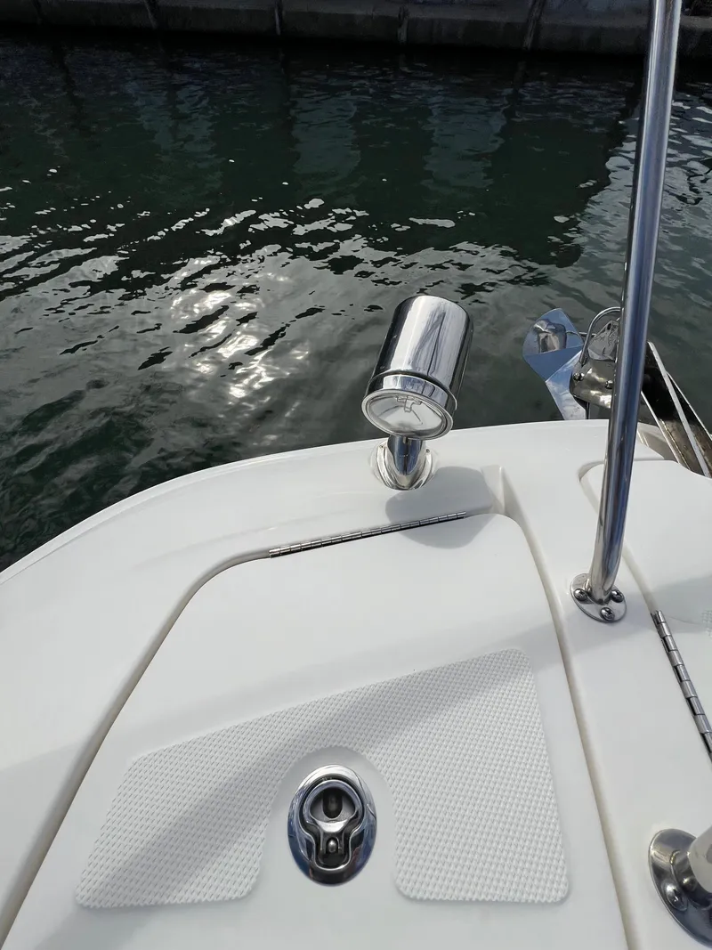 Slide: The Image of 2022 Sea Ray Sundancer 320 OB boat deck with water reflection. - 42