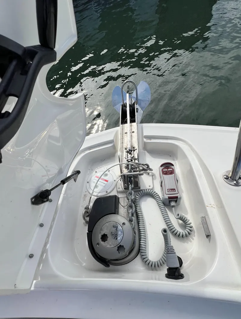 Slide: The Image of 2022 Sea Ray Sundancer 320 OB anchor system on deck by the water. - 43