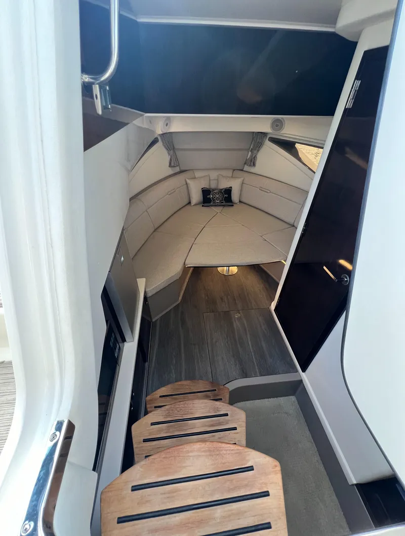 Slide: The Image of Interior cabin of 2022 Sea Ray Sundancer 320 OB, featuring modern design and comfortable seating. - 45
