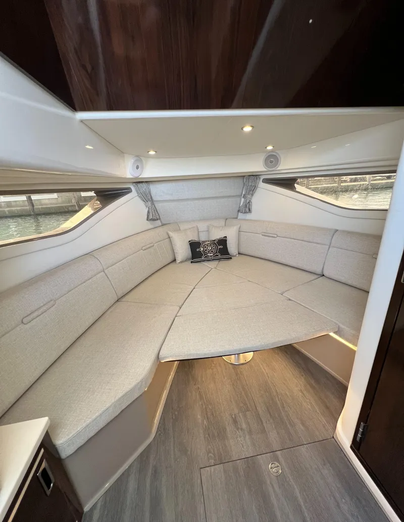 Slide: The Image of Luxurious interior of 2022 Sea Ray Sundancer 320 OB with elegant seating and modern design. - 48