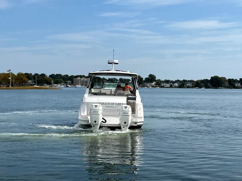 Slide: The Image of 2022 Sea Ray Sundancer 320 OB cruising on a calm lake. - 7