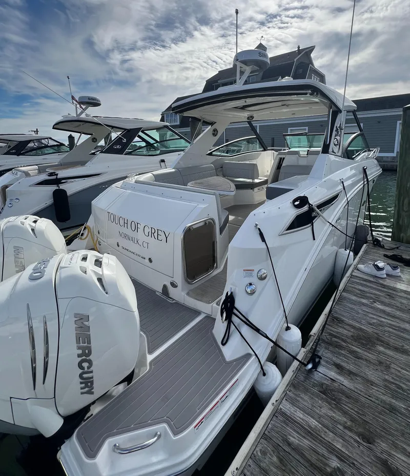 Slide: The Image of 2022 Sea Ray Sundancer 320 OB docked with Mercury outboard engines. - 9
