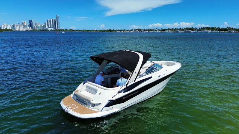 Slide: The Image of 2008 Crownline 300 LS boat cruising on a sunny day in scenic waters. - 1