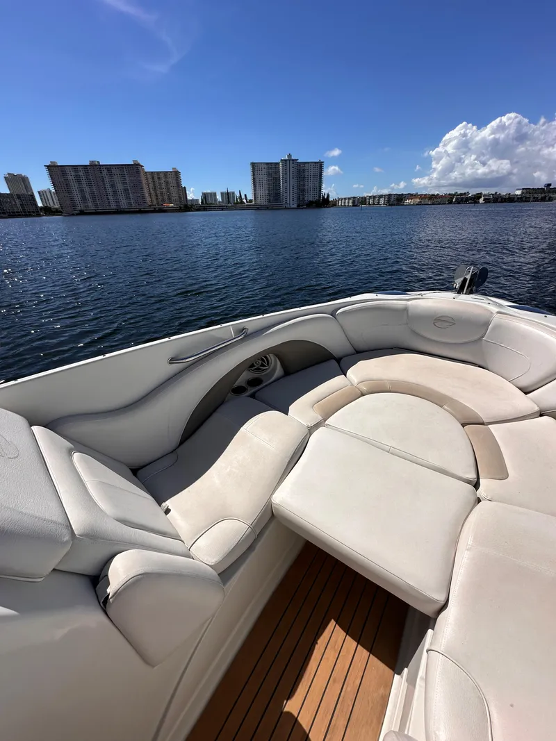 Slide: The Image of 2008 Crownline 300 LS boat interior with waterfront cityscape view. - 13