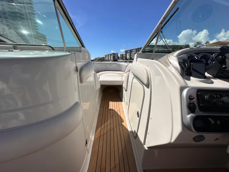 Slide: The Image of 2008 Crownline 300 LS boat interior with sleek design and wooden flooring. - 19