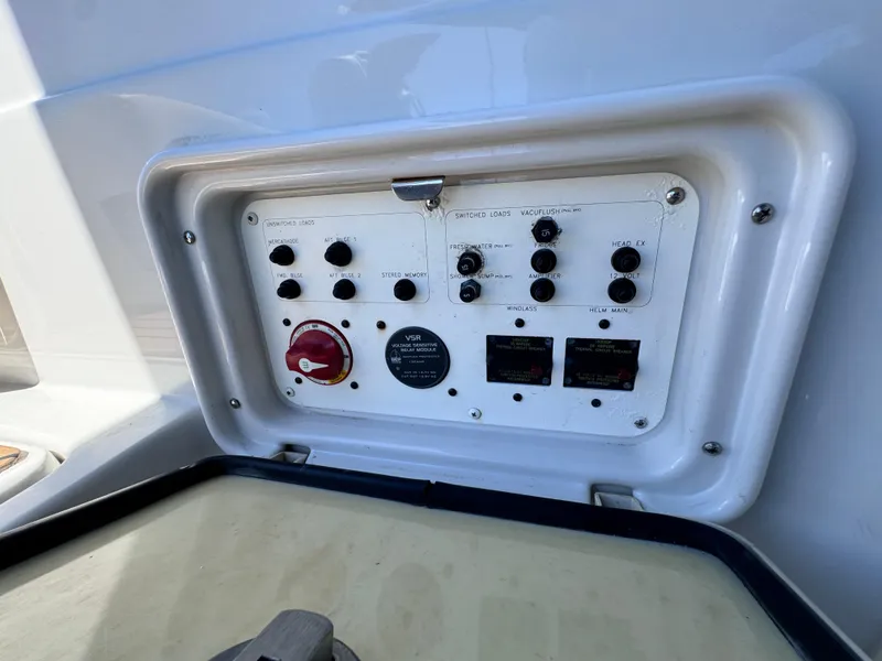 Slide: The Image of Control panel of a 2008 Crownline 300 LS boat with switches and gauges. - 30