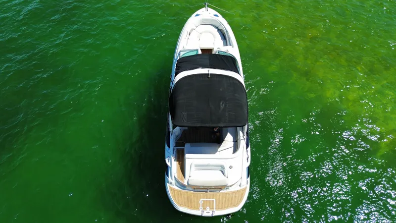 Slide: The Image of Aerial view of 2008 Crownline 300 LS boat on vibrant green water. - 6