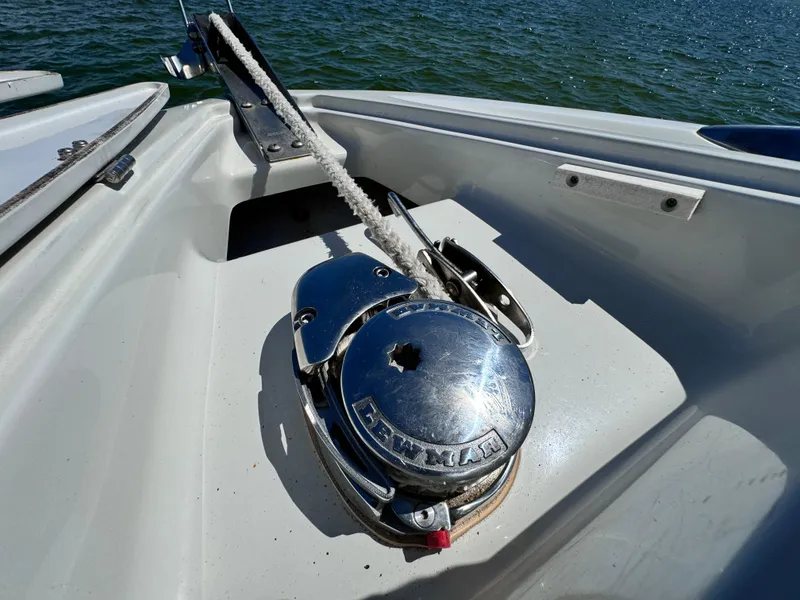 Slide: The Image of Crownline 300 LS 2008 boat anchor winch on deck by the water. - 8
