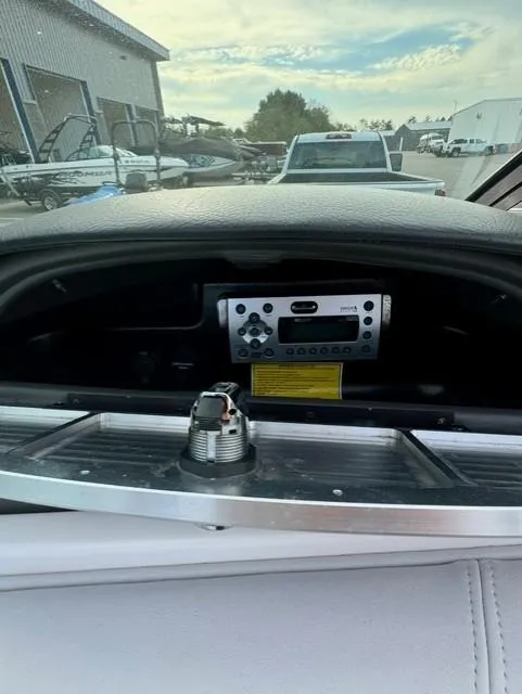 Slide: The Image of 2011 Supra 22v boat dashboard with stereo system and outdoor view. - 15