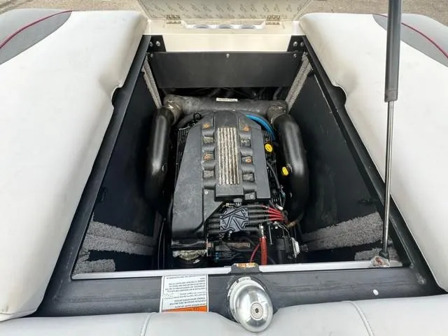 Slide: The Image of 2011 Supra 22v boat engine compartment with open hatch. - 18