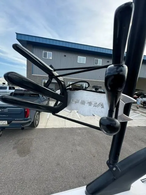 Slide: The Image of 2011 Supra 22v wakeboard rack in parking lot. - 19