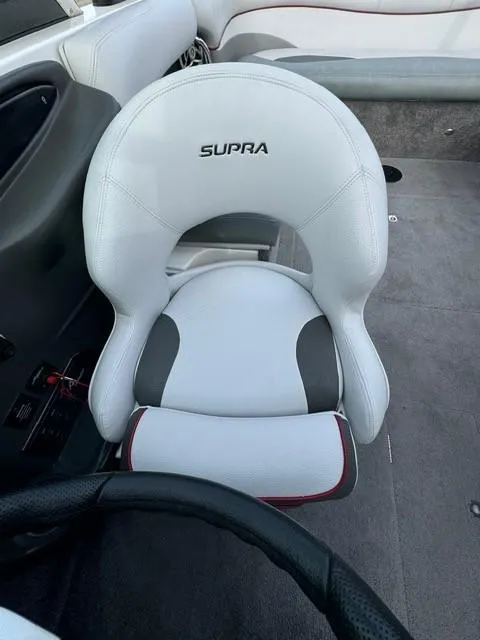 Slide: The Image of White Supra 22v boat seat, 2011 model, with black and red accents. - 7