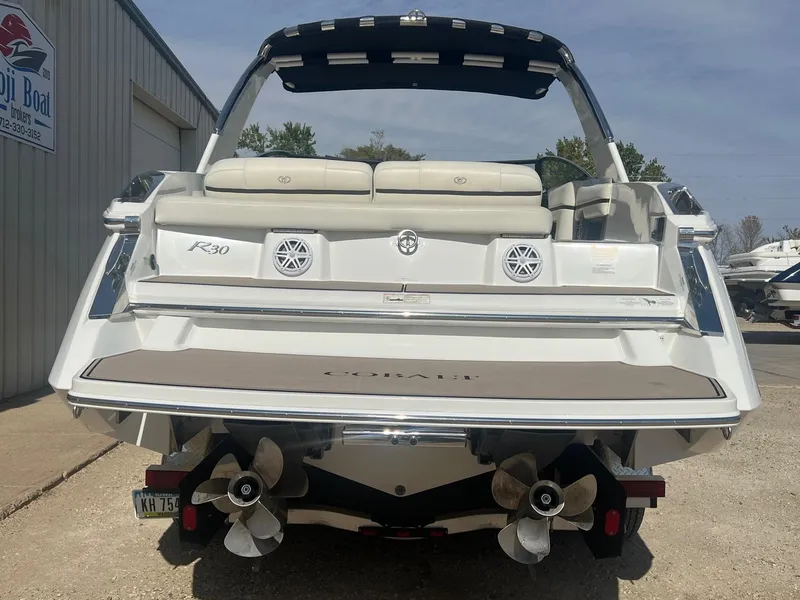 Slide: The Image of 2016 Cobalt R30 boat rear view with dual propellers and cushioned seating. - 11