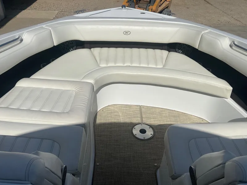 Slide: The Image of 2016 Cobalt R30 boat interior with white leather seating and carpeted floor. - 12