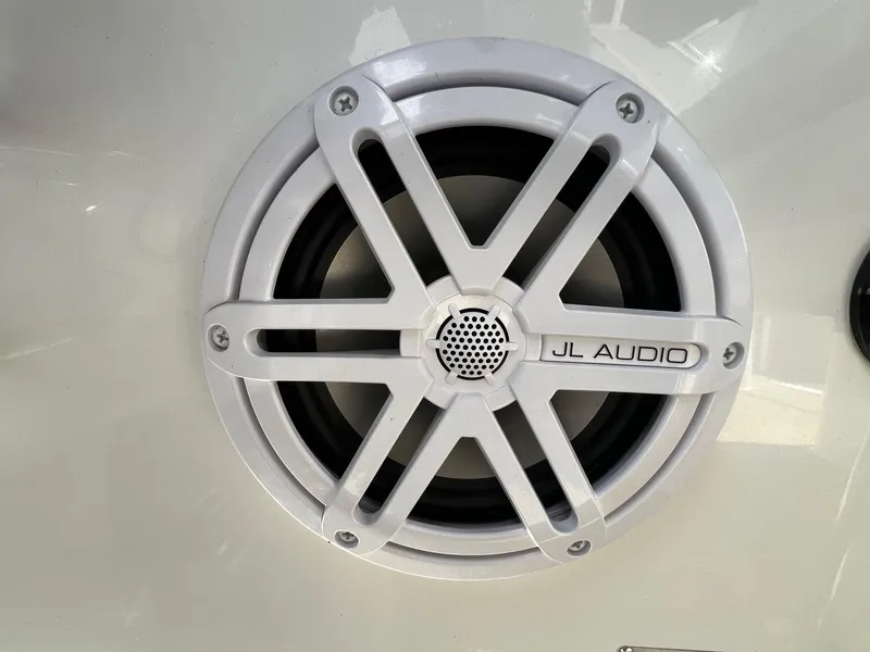 Slide: The Image of White JL Audio speaker on a 2016 Cobalt R30 boat. - 26