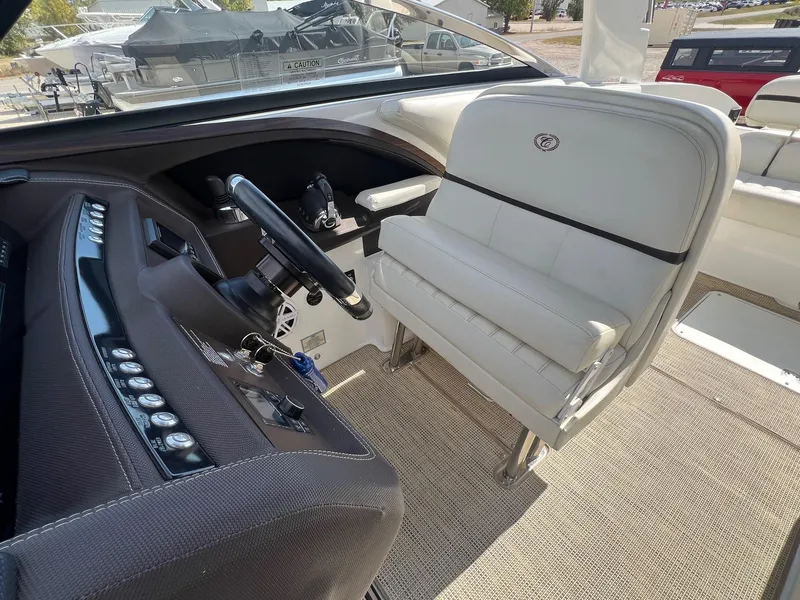Slide: The Image of 2016 Cobalt R30 boat interior with steering wheel and white seating. - 29