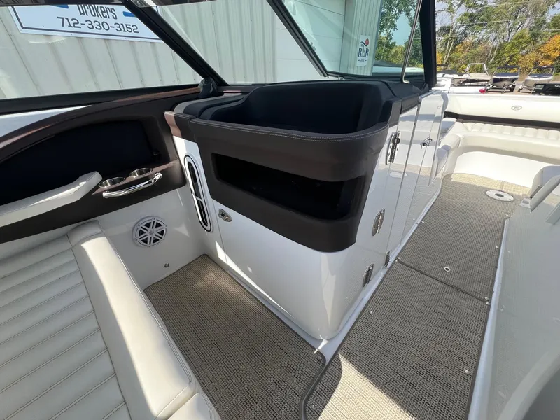 Slide: The Image of 2016 Cobalt R30 boat interior with seating, storage, and speaker. - 32