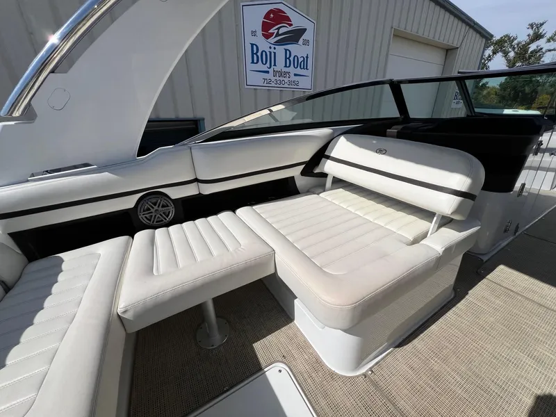 Slide: The Image of 2016 Cobalt R30 boat interior with white seating and Boji Boat Brokers sign. - 35