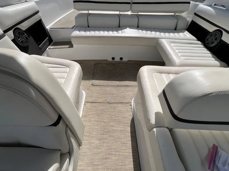 Slide: The Image of Interior of a 2016 Cobalt R30 boat with white leather seating. - 36