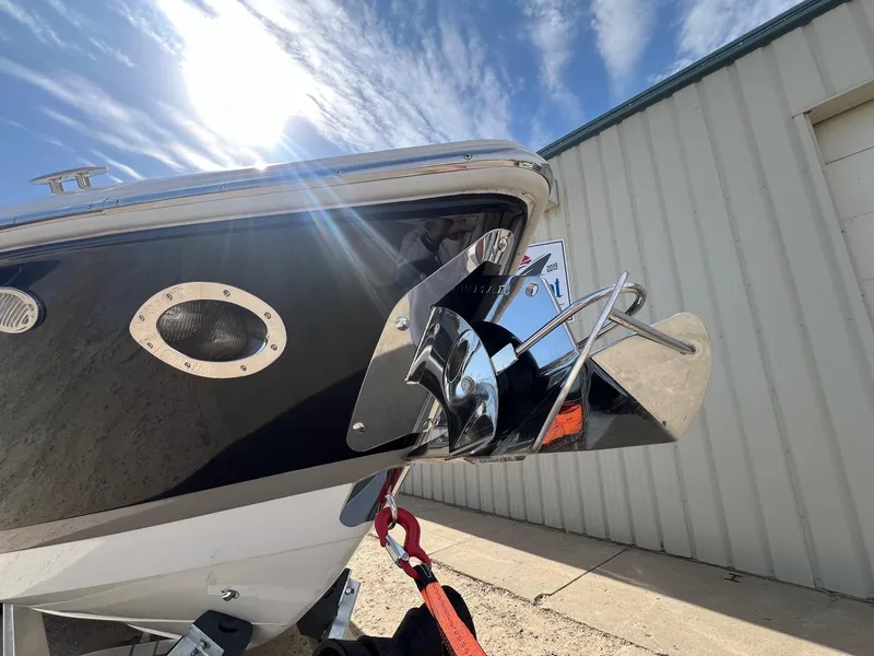 Slide: The Image of 2016 Cobalt R30 boat bow with anchor, under bright sun and blue sky. - 4