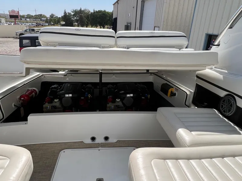 Slide: The Image of 2016 Cobalt R30 boat engine compartment with open seating and visible engines. - 40