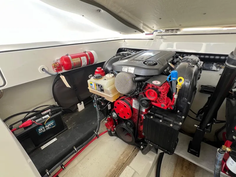 Slide: The Image of Engine compartment of a 2016 Cobalt R30 boat with visible fire extinguisher and battery. - 42