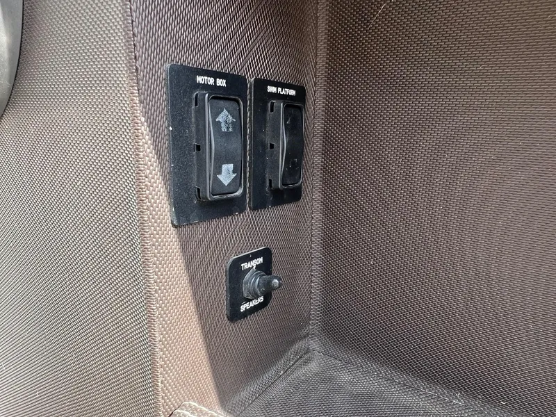 Slide: The Image of Control panel on 2016 Cobalt R30 boat with motor box and swim platform switches. - 48